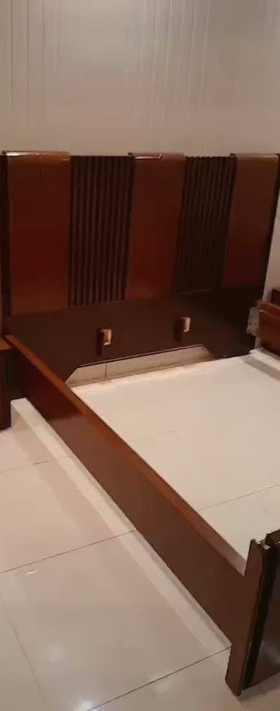 Wooden bed with a wood headboard and side table