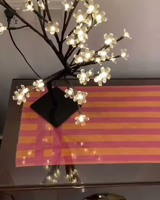 Side table with a blossom lamp